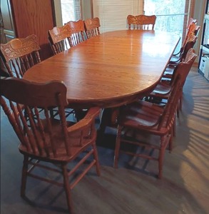 Seely Brand Oak Dining Room Table with 10 Chairs.   Table measures 30 x 114 x 48, with all the leaves.   Has 3 leaves each leaf is 10 x 48