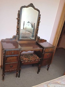 lot 203 image: Vanity with Mirror and Bench.  Dark Walnut Finish with Scrollwork.  6 Drawers.  68 x 52 x 17.5.   Matches lots 201 and 202.   Located Upstairs
