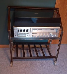 lot 208 image: Imperial by Superscope Stereo with Cassette Player,  8 Track, Record Player and a Stand on Wheels.  29 x 29 x 16.  Located Upstairs