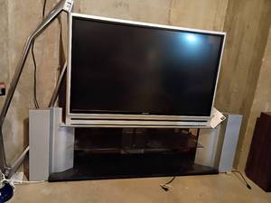 lot 310 image: Toshiba Theatre Wide Television with Stand and Remote.  T.V. is 50in.   Stand is 22 x 62 x 16.   Located in Basement