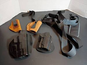 lot 353 image: Gun Holsters and Extra Straps