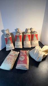 lot 1081 image: Various bags of chilled lead shot (the 4 along the back are not heavy with lead)