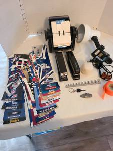 lot 1217 image: Arrowhead, clamp lamp, staplers, NFL stadium banners, rolodex.