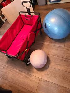 lot 1244 image: Folding utility wagon with red canvas and 2 balls that need inflated