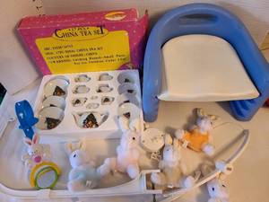 lot 1330 image: Childs China Christmas tea set, booster seat, plush bunny musical crib mobile