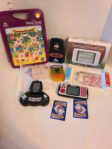 lot 1338 image: Electronic games and 2 Pokemon cards