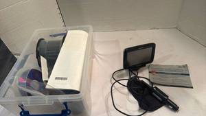 lot 1543 image: Magellan RoadMate portable GPS navigation device and blank CDs and dvd rom
