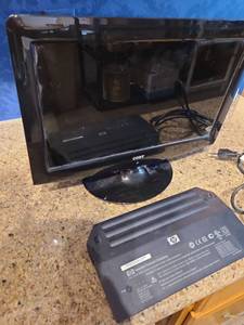 lot 1569 image: Coby TFTV1525 15-inch LCD TV and older version HP laptop battery