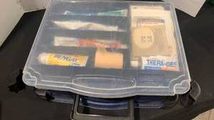 lot 1664 image: Carry case with first aid supplies and tooth paste