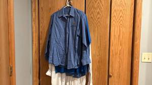 lot 1707 image: One tshirt, two long sleeve Via Christi shirts and one KU long sleeve shirt
