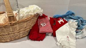 lot 1767 image: Basket of cloth diapers and baby clothes