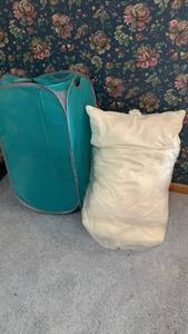 lot 2025 image: Bed pillows and hamper
