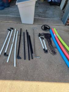lot 3337 image: Trash can, pool noodles, soccer goal frame.