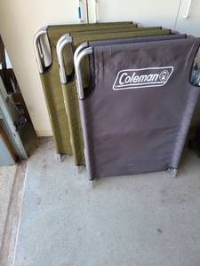 lot 3404 image: 3 Coleman folding cots and one egg crate cushion