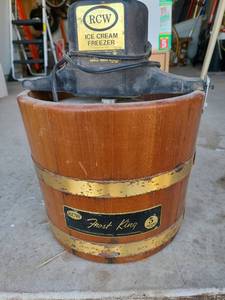 lot 3407 image: Vintage RCW Frost King ice cream freezer with wooden base.