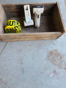 lot 3408 image: Caution tape, 2 rechargeable flashlights and a very old wooden box.
