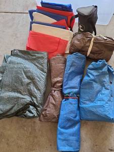 lot 3503 image: Tarps and red, white and blue reusable plastic tablecloths