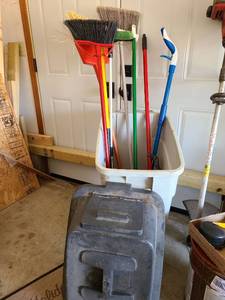 lot 3612 image: Trash can with brooms and mops