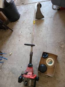 lot 3614 image: Homelite gas powered weedeater with trimmer line
