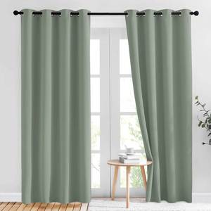 lot 4999 image: NICETOWN Blackout Sage Green Curtains 84 inch Length 2 Panels Set - Chic Thermal Insulated Grommet Room Darkening Window Drapes for BedroomLiving Room, W52 x L84 - Retail $25