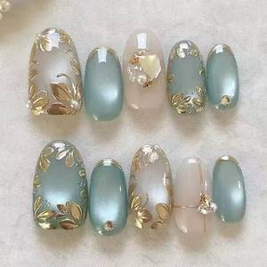 lot 5226 image: Cat Eye Press on Nails Short Almond Fake Nails 3D Gold Flowers False Nails Press ons French Tip Acrylic Nails Blue Artificial Glue on Nail for Women Manicure Nails Decoration - Retail $7