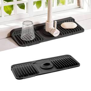 lot 5751 image: ZJWZLG Faucet Mat for Kitchen Sink, 14X5.5 Silicone Sink Splash Guard with Soap Holder, Snap-On Design &amp 7°slope Fast Drain, Folding Sink Faucet Mat for Universal Kitchen Bathroom Sink Black - Retail $10