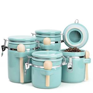 lot 6948 image: ZEBERBO 4-Piece Airtight Ceramic Canisters Set with Wooden Spoons &amp Chalk Labels Perfect for Coffee, Sugar, Flour, Tea (Turquoise) Stylish &amp Leakproof Kitchen Storage - Retail $60
