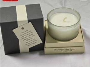 lot 56903 image: 144 count NewSealed Chamomile Shea Butter Soy Blend Candle with Inspirational Message