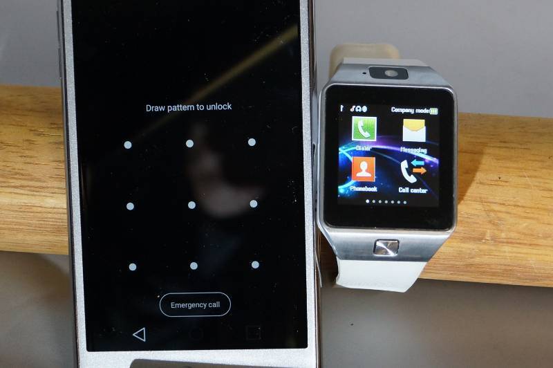 lot 222 image: Smart Watch and Cell Phone