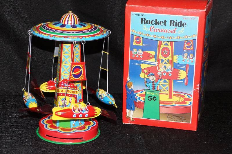 lot 248 image: Windup Tin Toy- Rocket Ride Carousal