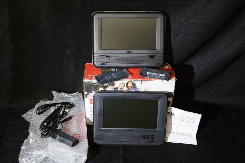 lot 254 image: Duel RCA Mobile DVD System- Appears Unused-  Great for Holiday Travels