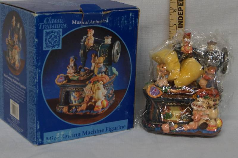 lot 374 image: Musical Figurine- Sewing Machine