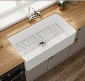 lot 20488 image: White Fireclay 33 in. Single Bowl Farmhouse Apron Kitchen Sink with Bottom Grid and Basket Strainer - Retail $309
