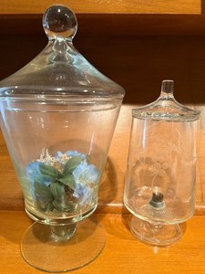 lot 21 image: Covered Glass Jars (both have been used for flower displays)