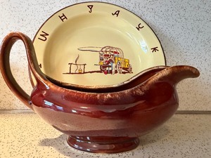 lot 24 image: Monterrey Western Ware Enamel Dinner Plate and Hull Gravy Boat (used to hold flowers - please see pictures)