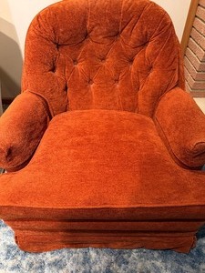 lot 37 image: MCM Rusty Orange Swivel Rocking Chair (has some wear and tear)