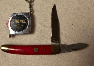 lot 157 image: Bronco Measuring Tape and a Vintage Pocket Knife