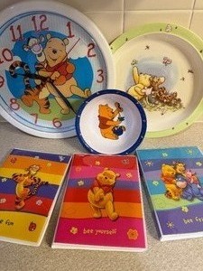 lot 46 image: Winnie The Pooh Clock, Plastic Plates and Photo Books