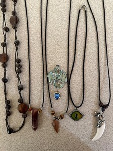 lot 73 image: Costume Jewelry - Leather Necklaces w Various Pendants, RockCrystals, Dragons Eye and More