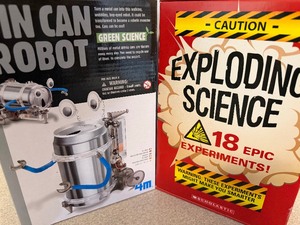 lot 75 image: Tin Can Robot (not sealed but appears unopened) and Exploding Science (appears new) Kits