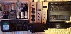 lot 308 image: Electronics - Batteries, Chargers, Tiny Radio, Phone, and Power Strips