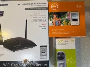 lot 504 image: Router (appears new), Z22 Handheld Palm (has boxinstructions), 360 Cam (sealed box) and a ThreeLeaf Wireless Speaker