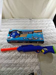 lot 28 image: Hover Soccer Set with LED Lights and Bonus Predator Toy Gun