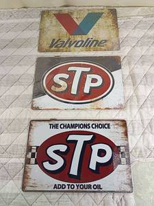 lot 119 image: 3 signs 8x12in all in plastic stillValvoline and STP Motor Oil Advertising Metal Signs