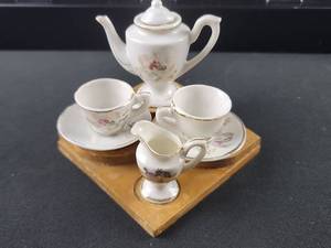 lot 3553 image: Miniature White Porcelain Tea Set with Floral Design