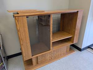 lot 10 image: Solid Oak TV Stand Adjustable Shelves and Side Storage Doors  - Retail $85