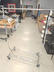 lot 37 image: Folding Commercial Chrome Garment Rack with Wheels  - Retail $75