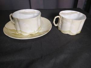 lot 3004 image: White Porcelain Tea Cup and Saucer Set with Scenic Design