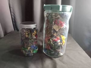 lot 2317 image: Mixed Toy Figure Collection in Glass Jars