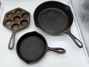 lot 101062 image: Lot of 3 Cast Iron Cookware Pieces Skillet Pan and Aebleskiver Pan